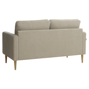 Kahden istuttava Mila-sohva hiekanväriselllä Feel 05 -kankaalla ja luonnonvärisillä pyöreäkartion mallisilla jaloilla.