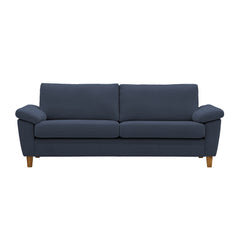 Monika 3-istuttava sinisellä Oasis 12 -kangasverhoilulla. Sohvassa on KN9-käsinojat ja luonnonväriset puujalat.