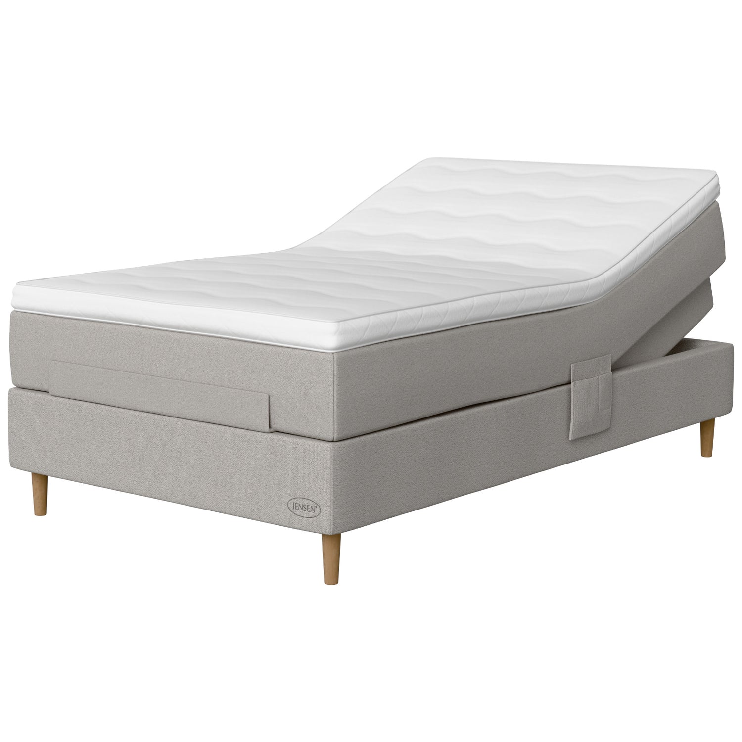 Jensen Opal -säätösängyn vaaleanharmaa Light Grey 186 -verhoilu ja luonnonväriset 14 cm korkeat Conic-tammijalat. Sijauspatja ja jalat sisältyvät hintaan.