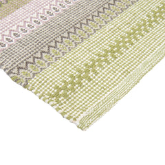 Polkka-puuvillamatto, lähikuvassa keltaisen sävyinen vihreä-keltainen väri.