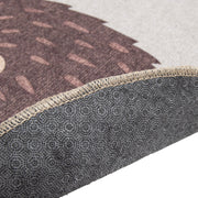 Kuvassa beigen ja ruskean sävytteisen Siilinen-lastenmaton pohjausta ja reunausta.