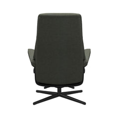 Stressless View, korkeaselkänojainen -lepotuoli ja rahi vihreänä: Green 90 Daisy -kangasverhoilulla ja mattamustalla Cross-metallijalustalla.