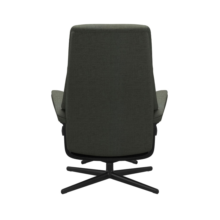 Stressless View, korkeaselkänojainen -lepotuoli ja rahi vihreänä: Green 90 Daisy -kangasverhoilulla ja mattamustalla Cross-metallijalustalla.