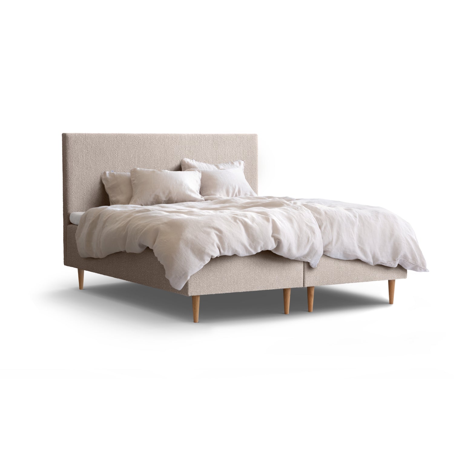 Tempur Break Box -runkosänkypaketti beigellä verhoilulla ja tammijaloilla. Kuvan Tempur Break Classic -sängynpääty ja petivaatteet myydään erikseen.