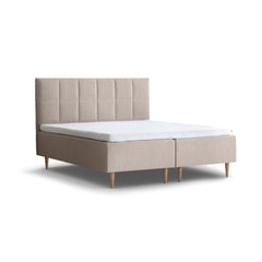 Tempur Break Box -runkosänkypaketti beigellä verhoilulla ja tammijaloilla. Kuvan Tempur Break Square -sängynpääty myydään erikseen.