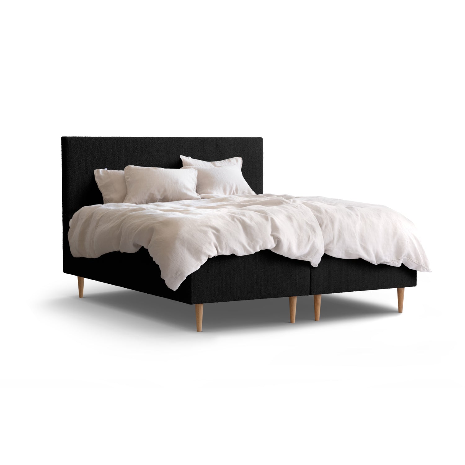 Tempur Break Box -runkosänkypaketti mustalla verhoilulla ja tammijaloilla. Kuvan Tempur Break Classic -sängynpääty ja petivaatteet myydään erikseen.