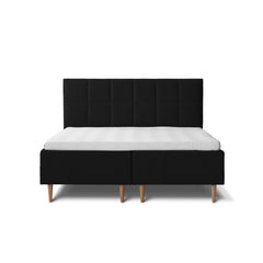 Tempur Break Box -runkosänkypaketti mustalla verhoilulla ja tammijaloilla. Kuvan Tempur Break Square -sängynpääty myydään erikseen.