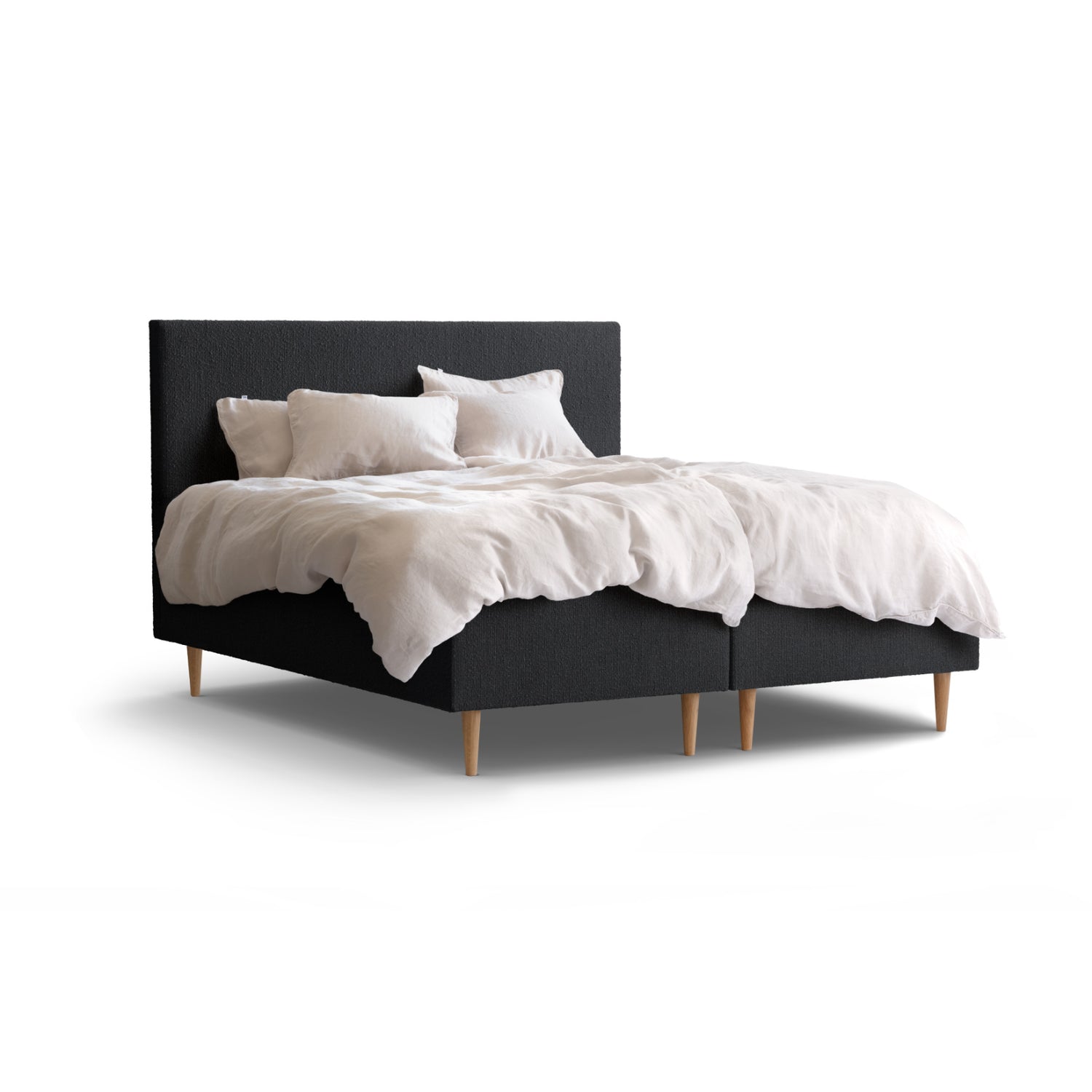 Tempur Break Box -runkosänkypaketti grafiitin värisellä verhoilulla ja tammijaloilla. Kuvan Tempur Break Classic -sängynpääty ja petivaatteet myydään erikseen.