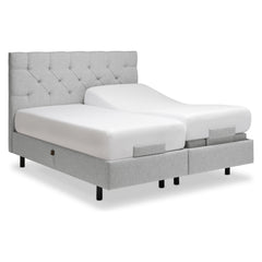 Kuvassa on Tempur Boxspring Adjustable -parivuodepaketti harmaalla Stone -kankaalla verhoiltuna ja TEMPUR PRO Plus CoolQuilt 27 cm patjalla, sekä tummilla vakiojaloilla. Kuvan sängynpääty myydään erikseen.