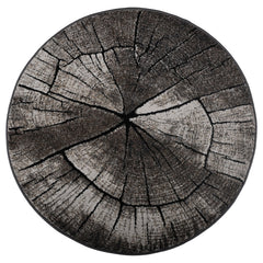 Pyöreä Timber-nukkamatto, harmaa. Maton näyttävä vuosirengaskuvio muistuttaa puun pintaa ja metsän harmonista tunnelmaa.