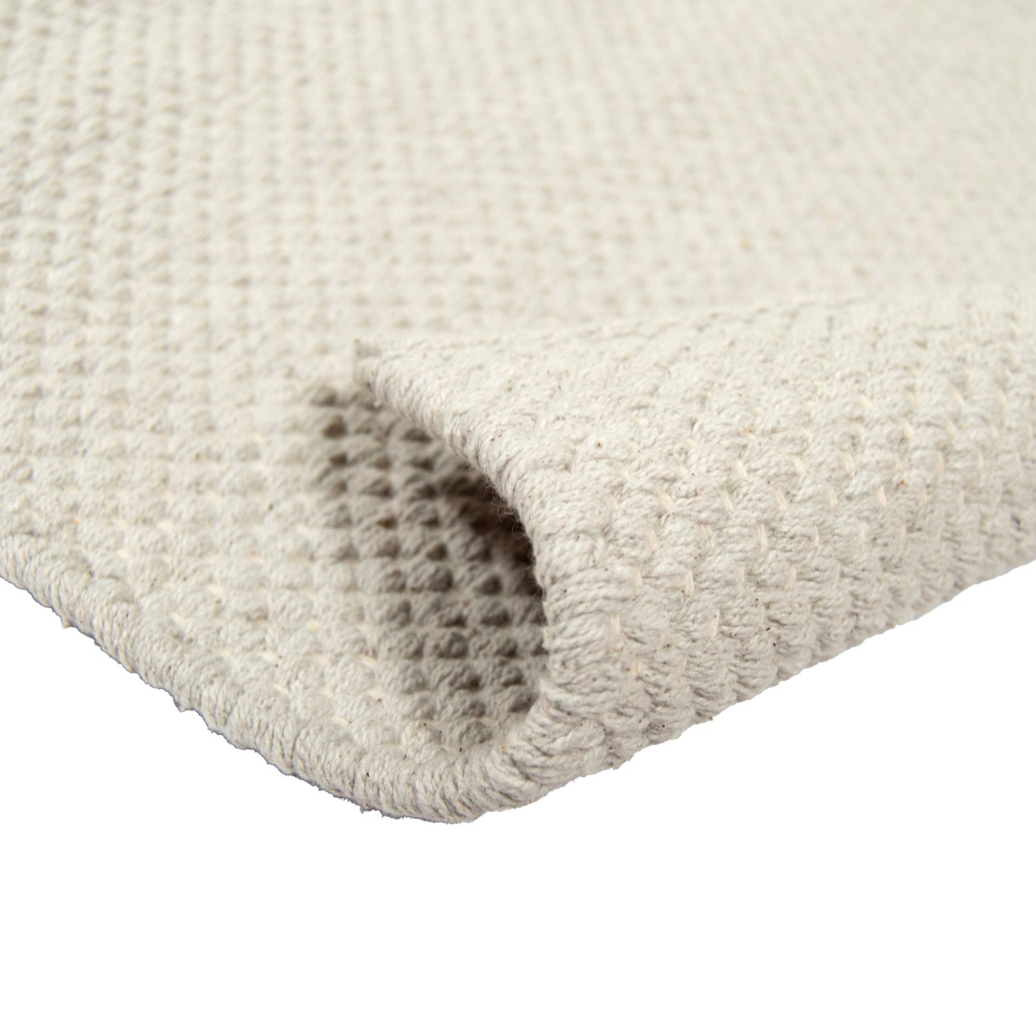 Lähikuvassa Ulappa-puuvillamatto, harmaa.