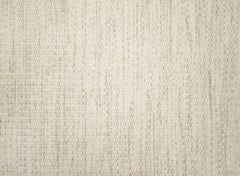 Emma-villamatto valkoisena. Emma-matto on kevyt ja käsinkudottu matto.