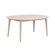 Pyöreä Filippa-ruokapöytä valkotammenvärisenä. Kuvassa pöytä on jatkettuna yhdellä mukana tulevalla jatkolevyllä, jolloin pöydän pituus on 165 cm.