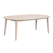 Pyöreä Filippa-ruokapöytä valkotammenvärisenä. Kuvassa pöytä on jatkettuna yhdellä mukana tulevalla ja toisella erikseen myytävällä jatkolevyllä, jolloin pöydän pituus on 210 cm.