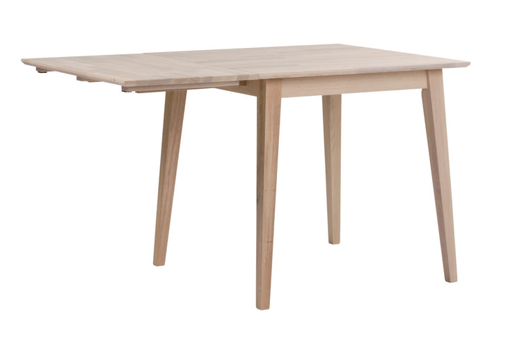 Valkotammen värinen Filippa-ruokapöydässä on 45 cm pituinen klaffiosa.