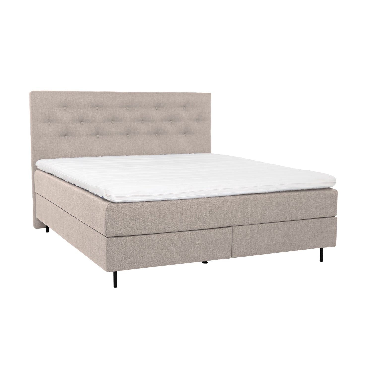 Beige Hilding Feel Ergo -jenkkisänky 160 x 200 cm mustilla pyöreillä 14 cm alumiinijaloilla ja Hilding Ergo -sijauspatjalla. Kuvan Feel -nappipääty myydään erikseen.