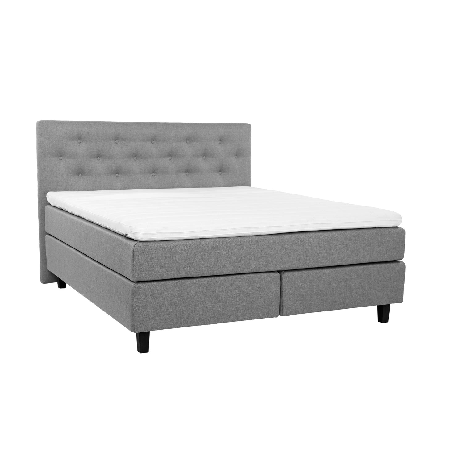 Harmaa Hilding Feel -jenkkisänky hiilenmustilla 14 cm korkeilla Royal -tammijaloilla ja yhtenäisellä Hilding Hybrix Air Coolmax -sijauspatjalla. Kuvan Feel -sängynpääty myydään erikseen.