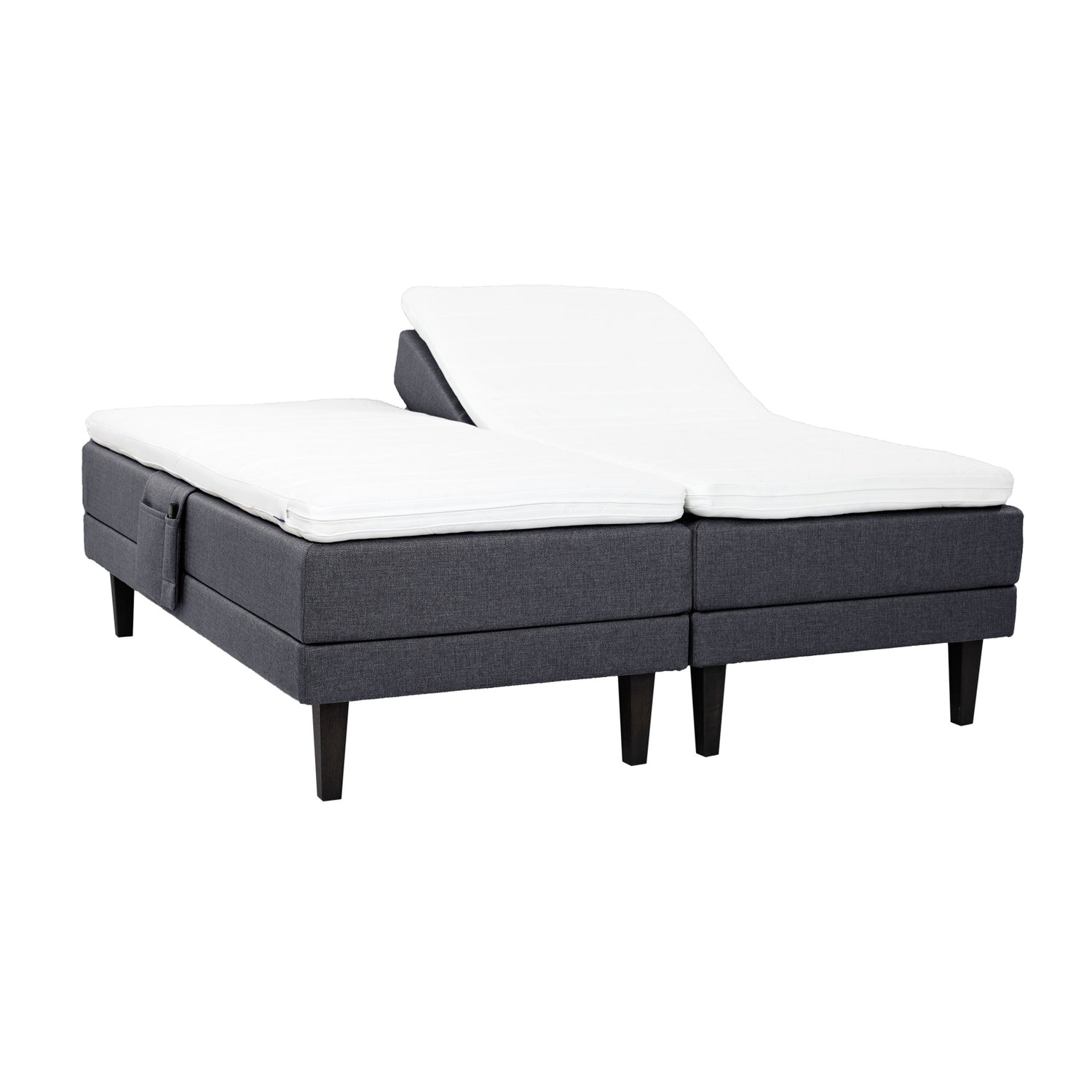 Antrasiitinväriset Hilding Feel Ergo -moottorisängyt 90 x 200 cm hiilenmustilla 23 cm korkeilla Royal -tammijaloilla ja erillisillä Hilding Ergo -sijauspatjoilla. Kuvan tarviketasku myydään erikseen.