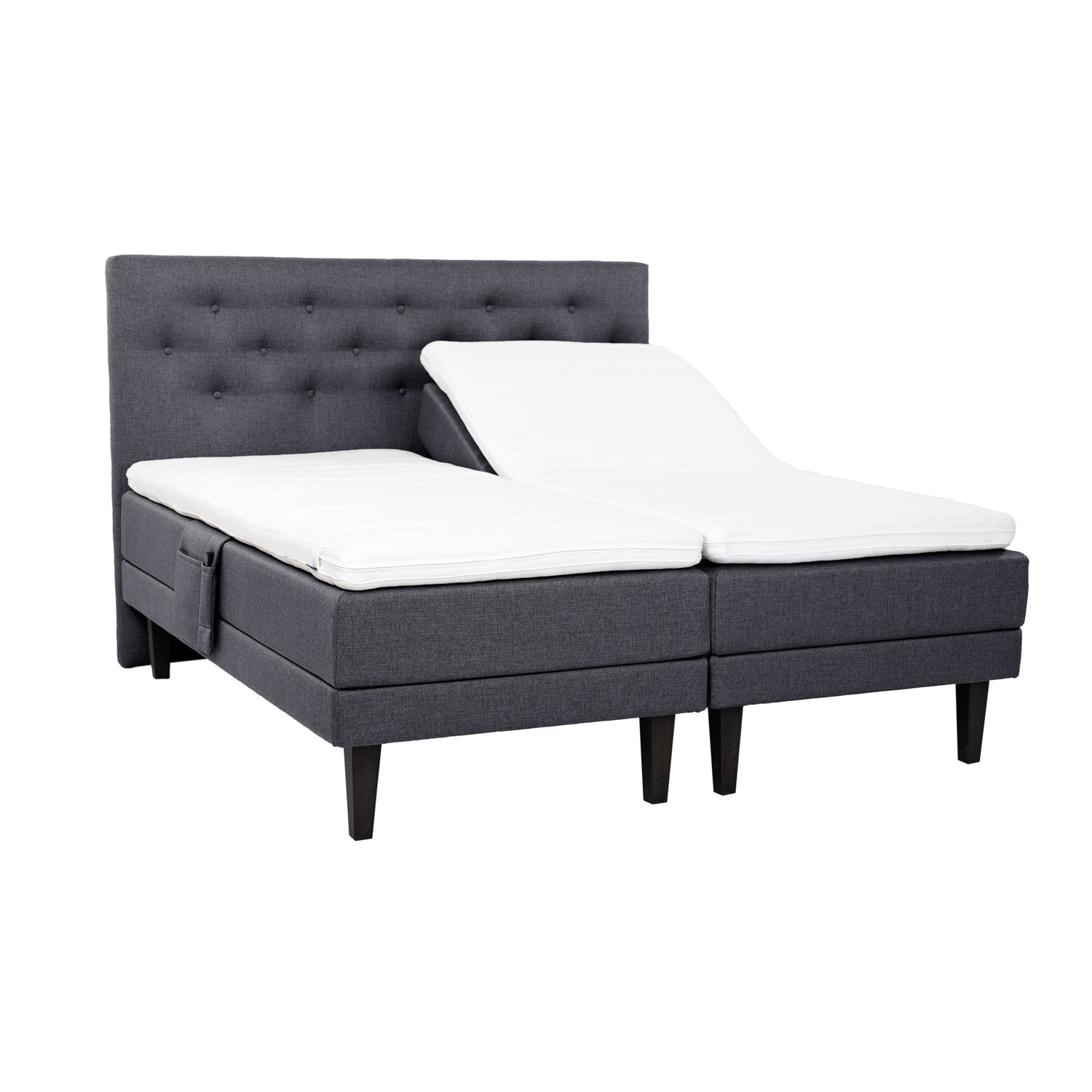 Antrasiitinväriset Hilding Feel Ergo -moottorisängyt 90 x 200 cm hiilenmustilla 23 cm korkeilla Royal -tammijaloilla ja erillisillä Hilding Ergo -sijauspatjoilla. Kuvan Feel -sängynpääty ja tarviketasku myydään erikseen.