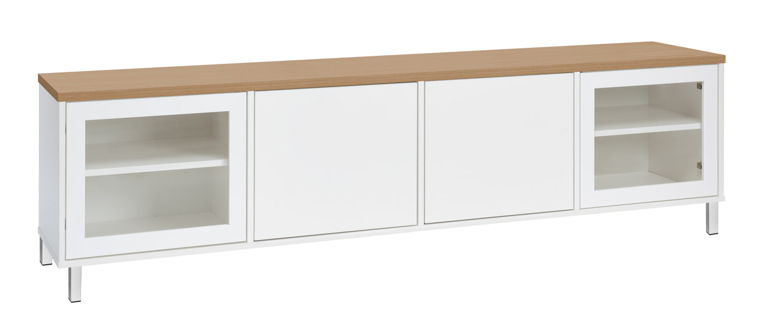 Kuvassa on 192 cm leveä valkoinen Kivi-sarjan tv-taso tammenvärisellä kannella ja valkoisilla metallijaloilla.