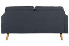 Tummansininen Nauvo 2-istuttava sohva luonnonvärisillä puujaloilla.