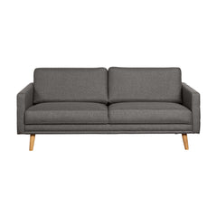 Nauvo-sohva tummanharmaalla Suma 7 -kangasverhoilulla ja luonnonvärisillä puujaloilla.