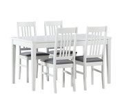 Valkoinen Saari-ruokapöytä ja Puro-tuolit harmaalla Gusto 94- istuinverhoilulla.