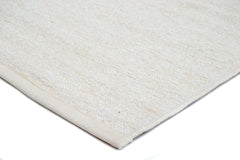 Lähikuva valkoisesta Saima-puuvillamatosta.