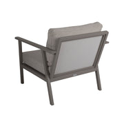 Samvaro-nojatuoli hiekanvärisellä alumiinirungolla, kaarevilla käsinojilla ja beigenvärisillä pehmusteilla.