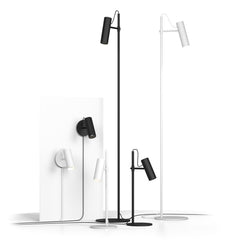 Kuvassa on Spot-sarjan valaisimia mattamustana ja mattavalkoisena. Spot-valaisinsarjaan kuuluu seinävalaisimen lisäksi pöytä- ja lattiavalaisin.