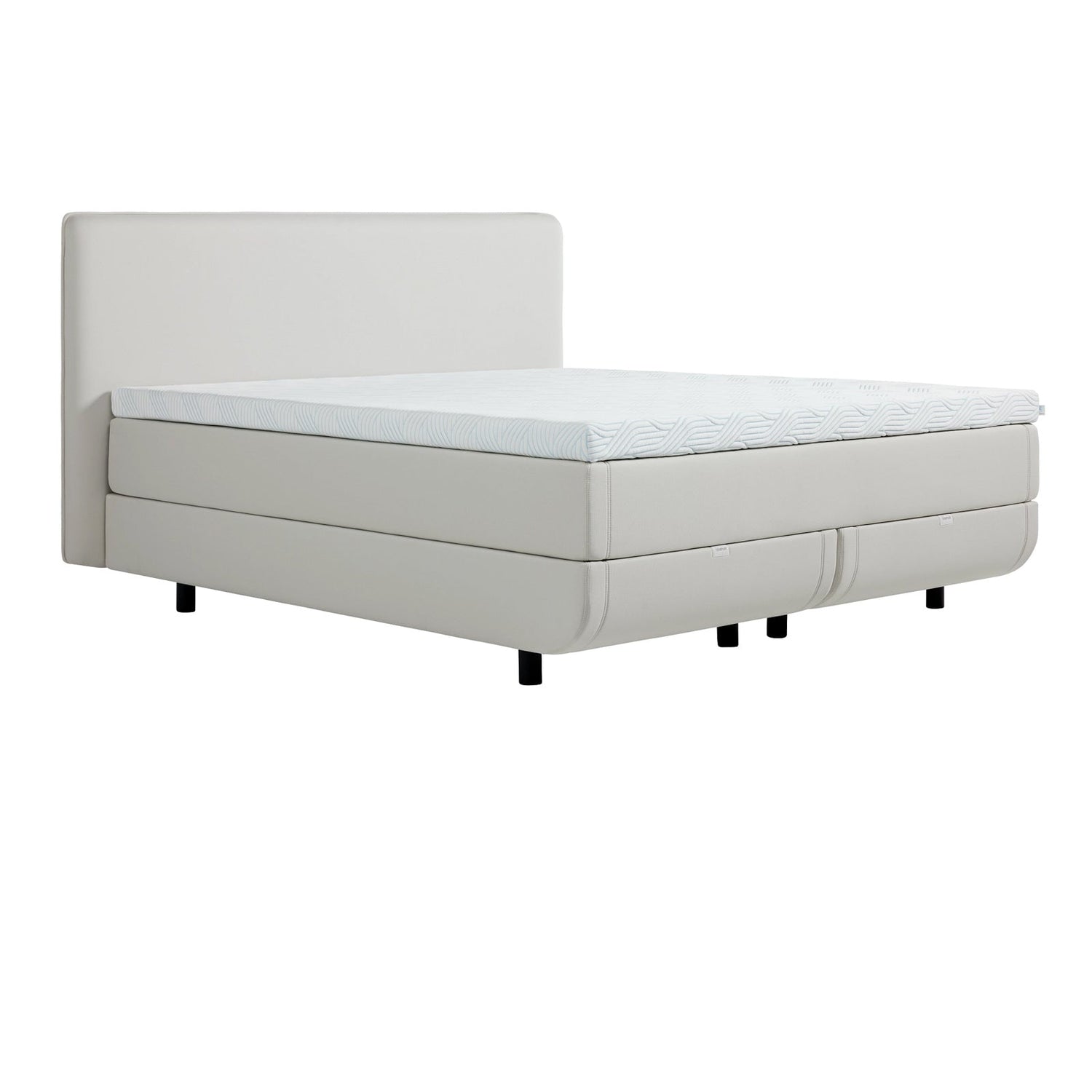 TEMPUR NORTH jenkkisänky vaalealla Ivory-kangasverhoilulla ja TEMPUR Pro Luxe SmartCool -sijauspatjalla, sekä mustalla jalkasarjalla. Kuvan sängynpääty myydään erikseen.
