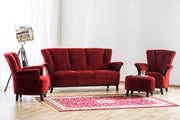 Kuvassa on Tuulia-nojatuoli osana sohvakalustoa, joka on verhoiltuna syvän punaisella Stemma-myymälöistä saatavalla Eros 41 -samettikankaalla. Puuosat ovat wengen väriset. Kuvan sohvakalustossa on lisäksi Tuulia 3 ja 2 hengen sohvat.