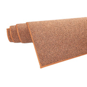 Terran värinen Tweed-matto rullalla.