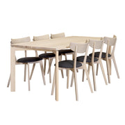 Kuvassa on yhdistetty erikseen myytävät Rowicon Ami-tuolit valkovahatun Twist-ruokapöydän kanssa.