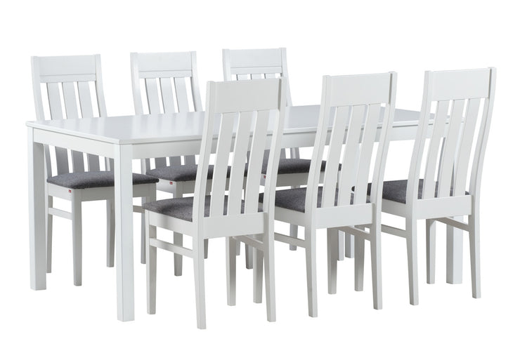 Kaisla/Kanerva 6 hengen ruokailuryhmä valkoisella pöydällä ja harmailla Gusto 94 kangasverhoilluilla Kanerva-tuoleilla.
