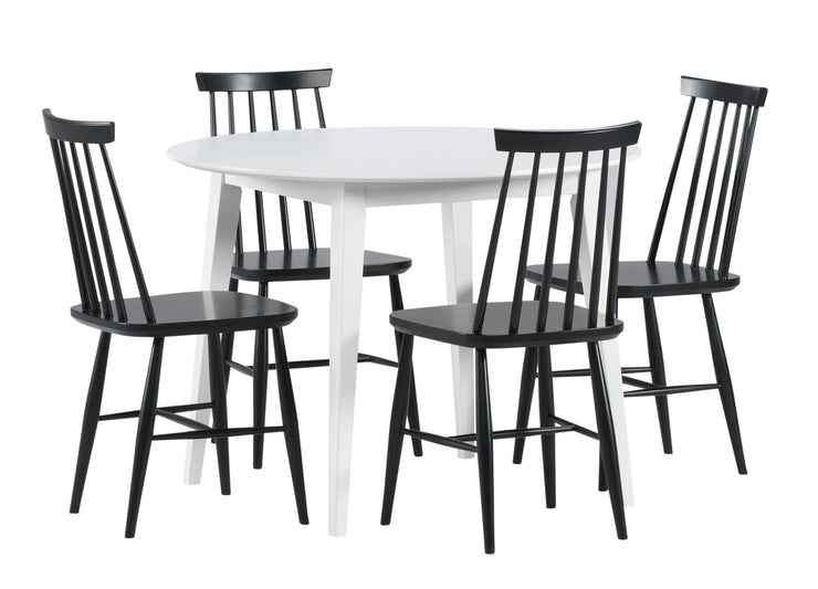 Pyöreä valkoinen 100 cm Laine-ruokapöytä ja mustat Ahven-tuolit.