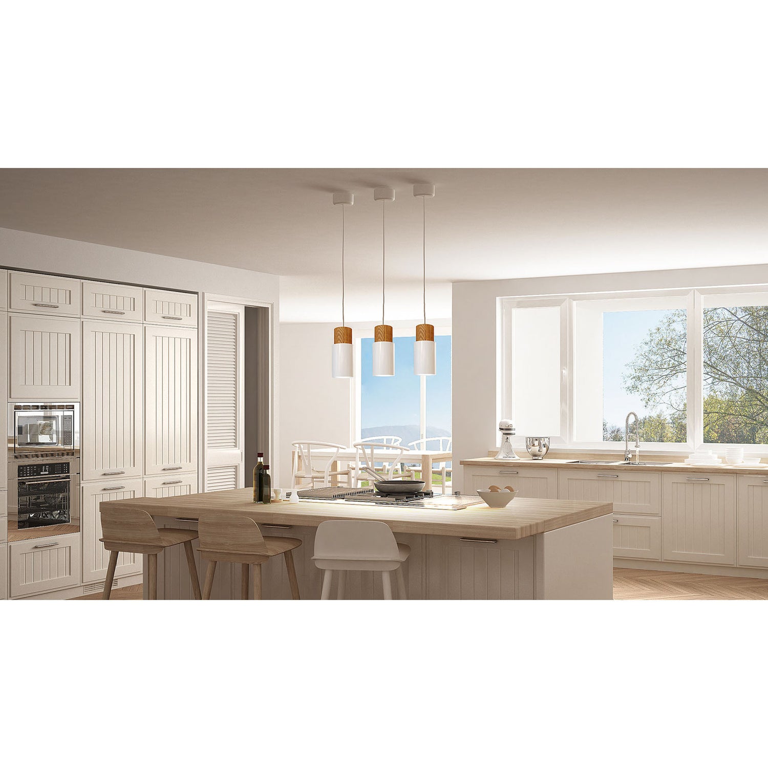 Log on Design by Grönlundin kattovalaisin, jota on kolmea eri kokoa. Kuvassa on pienimmät Ø 10 cm valkoiset Log-valaisimet useamman valaisimen rivissä keittiön saarekkeen päällä.